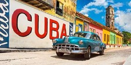 Vintage car and mural- Cuba