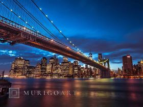 Brooklyn Bridge and lower Manhattan skyline at dusk, New York