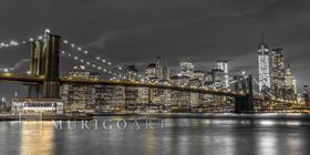 Brooklyn Bridge and lower Manhattan skyline at dusk, New York