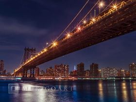 Brooklyn Bridge and lower Manhattan skyline at dusk, New York